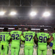 Members of the Seattle Seahawks, including defensive end Michael Bennett, No. 72, link arms during the national anthem for the NFL game against the Arizona Cardinals at University of Phoenix Stadium in Glendale, Ariz., on Nov. 9, 2017. (Christian Petersen/Getty Images)